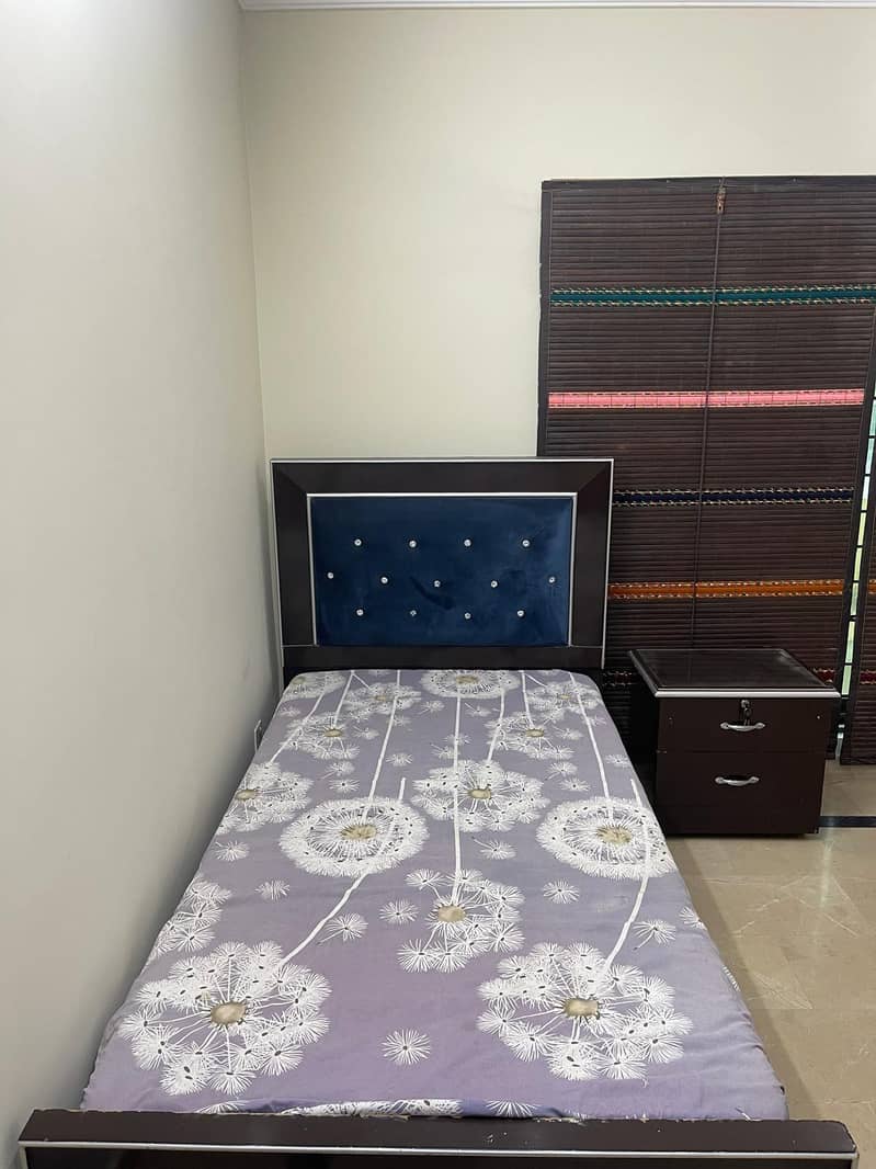 single bed with one side table 6