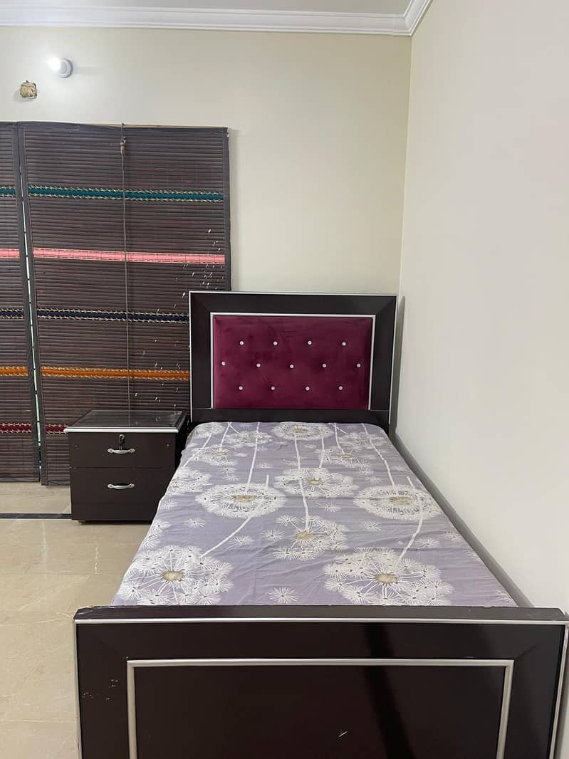 single bed with one side table 0