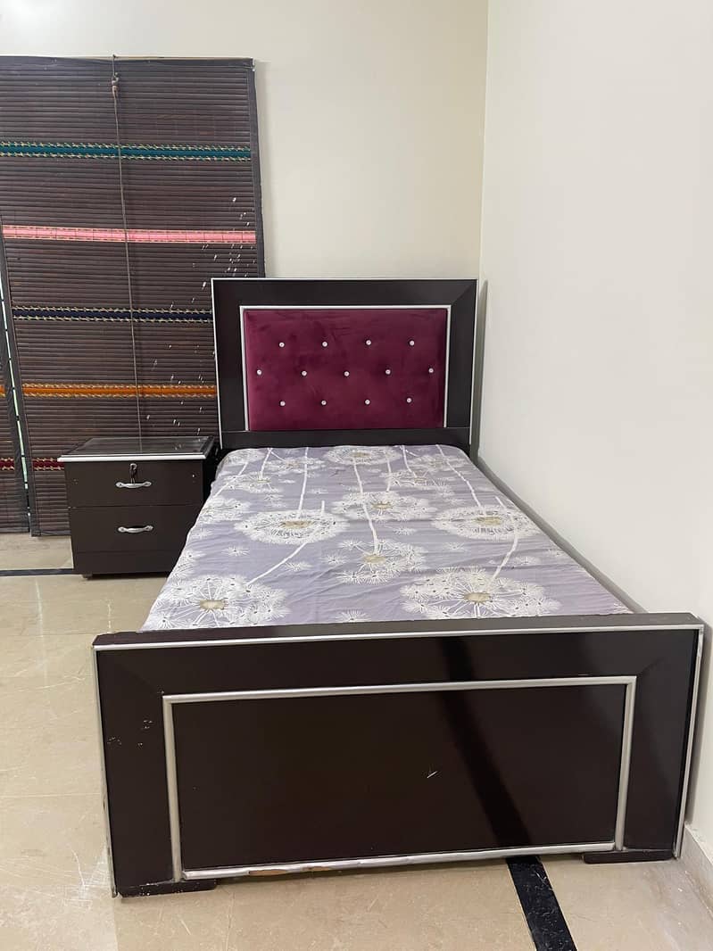 single bed with one side table 1