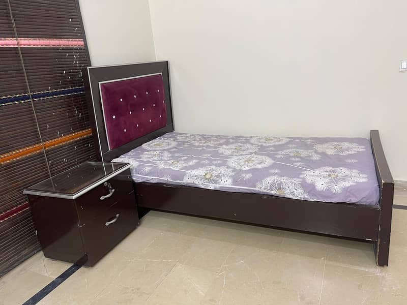 single bed with one side table 2