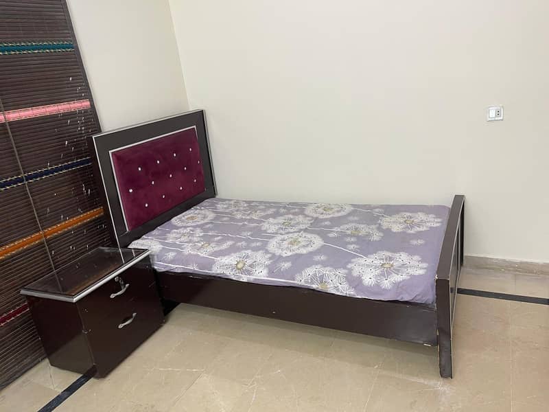 single bed with one side table 3
