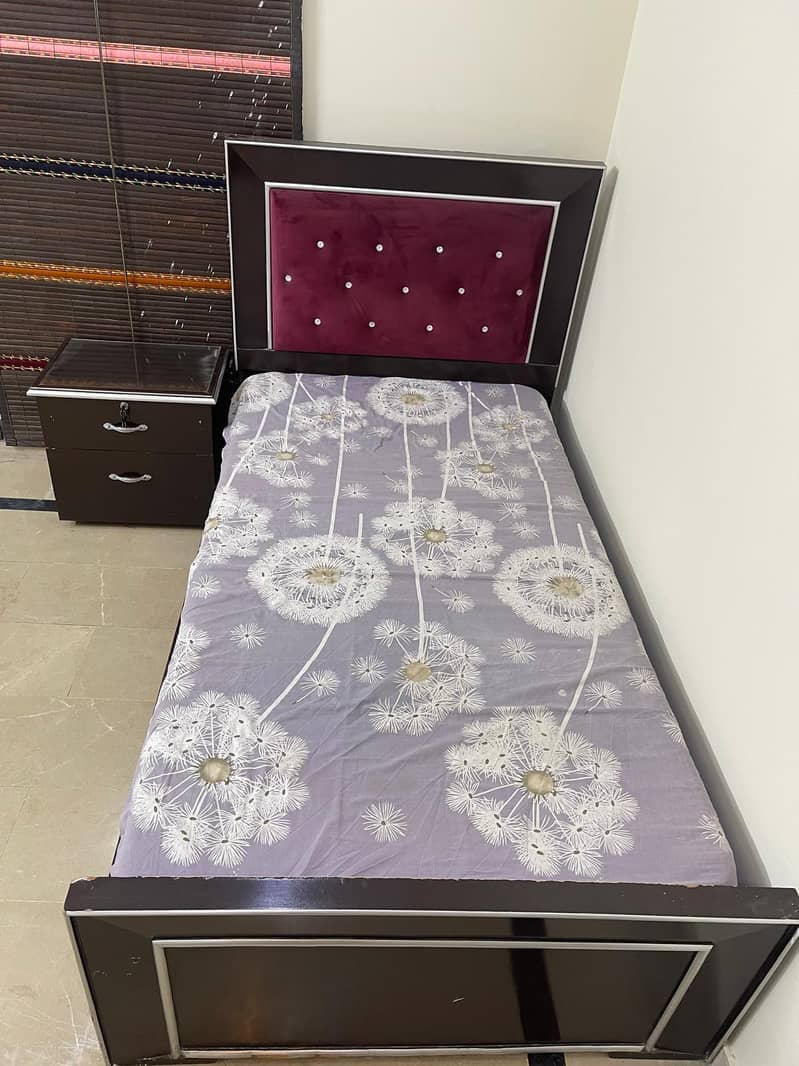 single bed with one side table 4