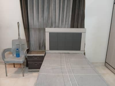 single bed with side table