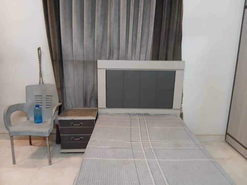 single bed with side table 0