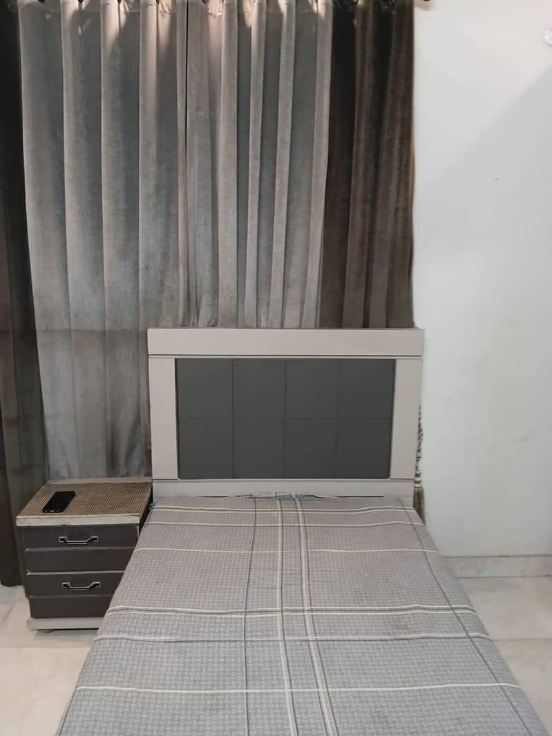 single bed with side table 1