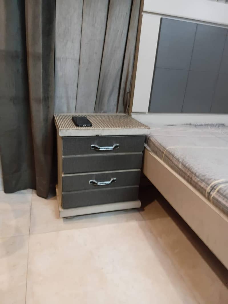 single bed with side table 4