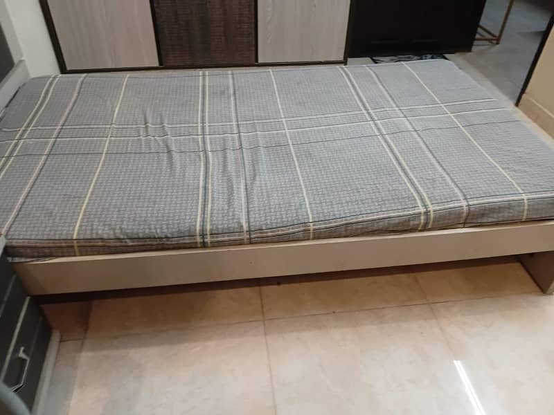 single bed with side table 7