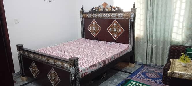 Double bed with mattress in good condition looking like new one