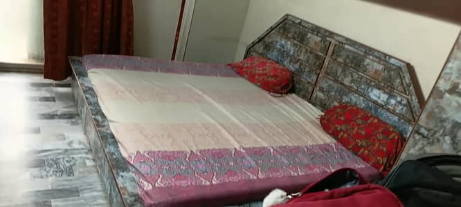 A very string Double bed with side tables