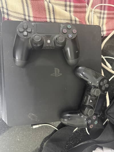 PS4 slim 500gb disk edition excellent condition with 3 controllers