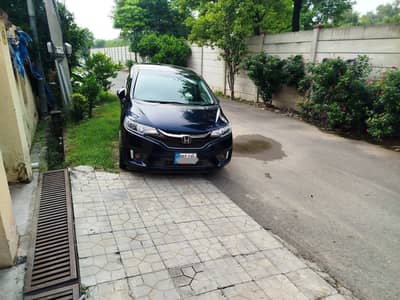 honda fit owned by a governmentt officer