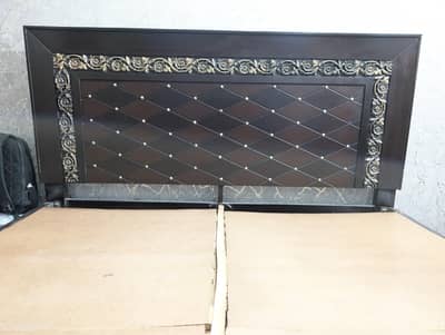 wooden and sheet double bed