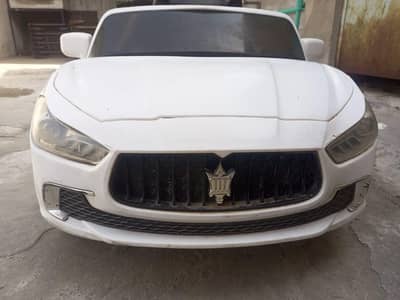 White kids electric ride-on car