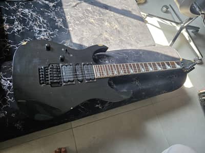 Premium Electric Guitar Ibanez (left) Stylish Design & Powerful Sound