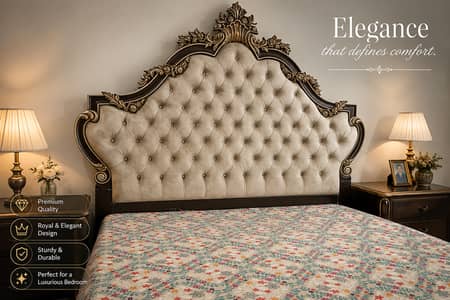 Ornate royal-style bed with a tufted headboard and antique-gold carve