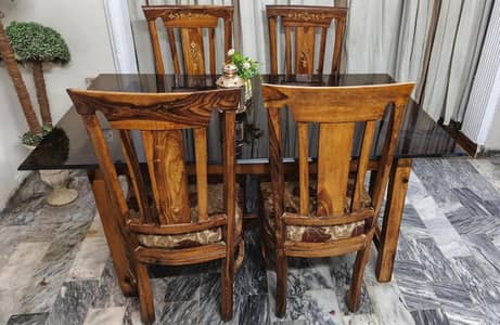 Wood dining table with heavy glass