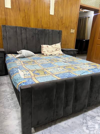 king size bed with side table and dressing table