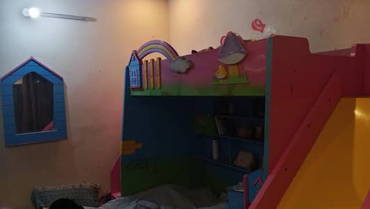 kid's bunker bed with slide.