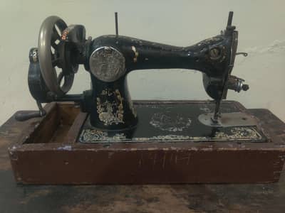 Vintage manual sewing machine with wooden base, Good working condition