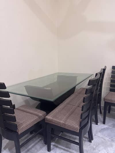 Dining Table. with 6 chairs. good condition 50k. wooden table glass to