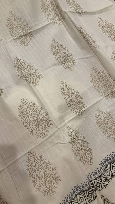 Unstitched three piece block print suit