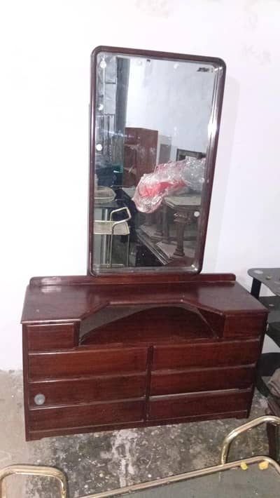 Beautiful wooden dressing table with mirror available for sale.