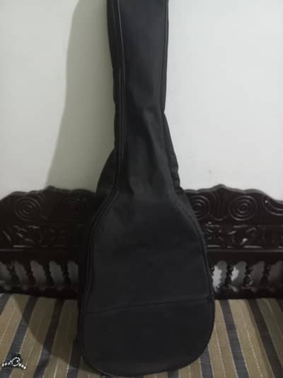 New guitar tuned 2 days used with one bag and one pick