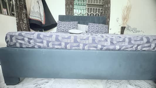 Cutioned bed with mattress