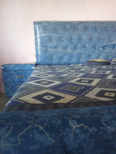 bed and one side table and dressing