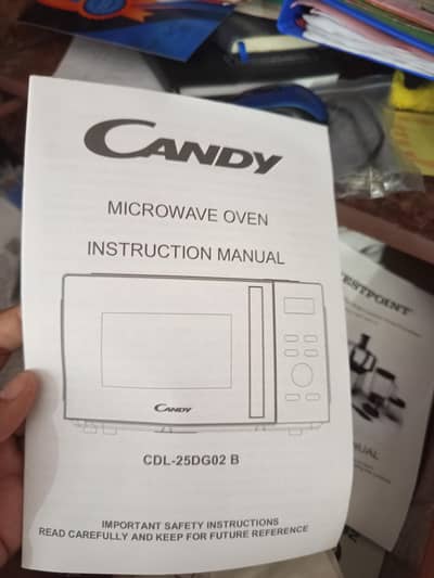 candy 25L/grilled microwave oven argent sale in new condition no dam n