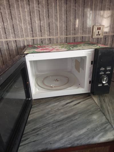 candy 25L/grilled microwave oven looking for house hold here we are