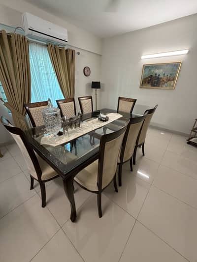 8 seater dining table with mirror top . Pure wood