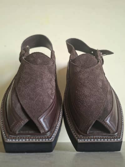 Brown leather Peshawari chappals.