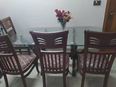 wooden dinning table with glass top