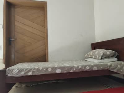 2 single bed for sale . good in condition. wooden or chip board mix hai.