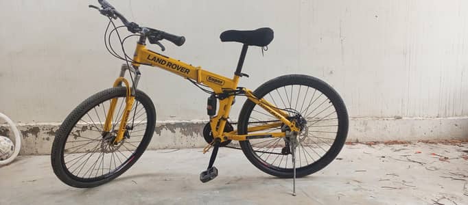 Brand: Land Rover, colour: yellow, foldable, price is Bargainable