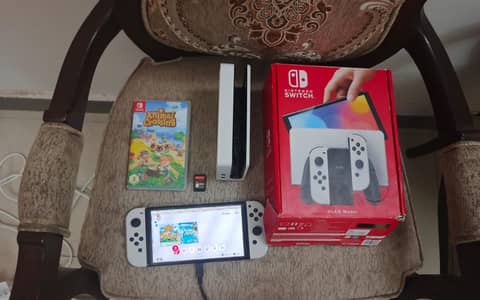 Nintendo switch oled with 2 games (animal crossing and Zelda)
