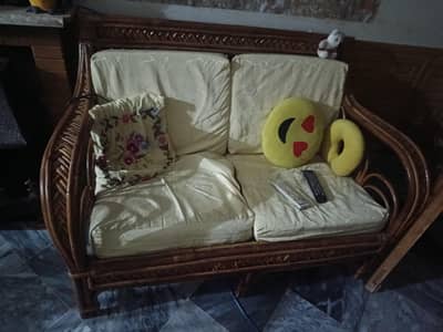cane sofa and tea trolly
