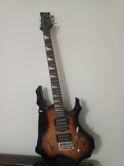 Vintage electric guitar signed by famous guitarist