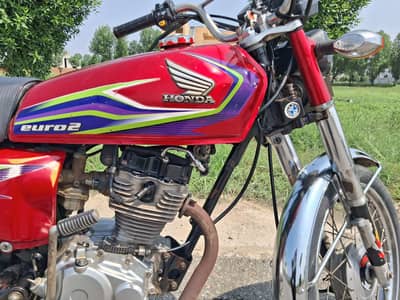 honda 125 red colour total genuine good condition