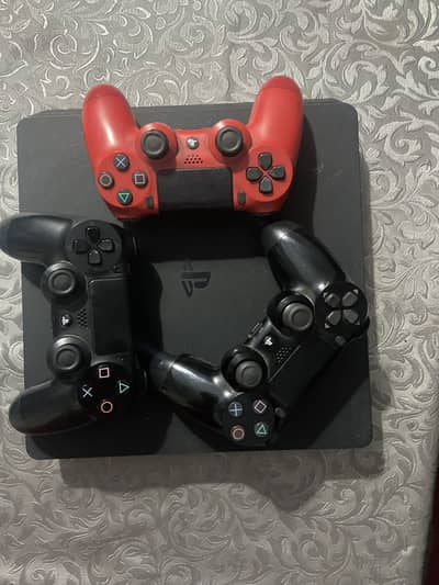 PS4 slim 500GB with 3 controllers and 6 games