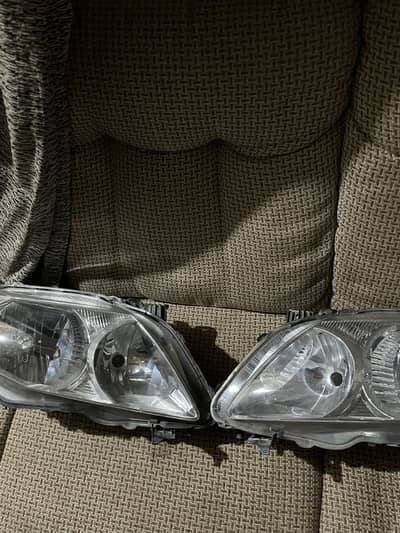 Toyota corolla 2009-2011 front headlights pair read ad