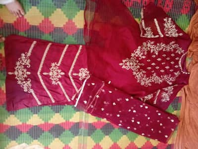 Use three pc maroon frock stitched