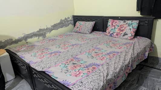 Two single bed with spring mattress.