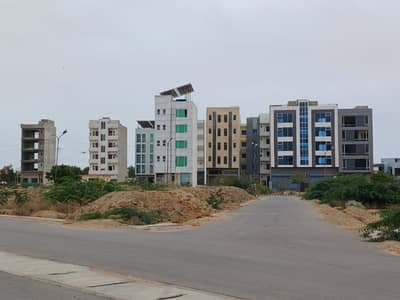 100 YARDS COMMERCIAL PLOT FOR SELL IN DHA PHASE 7 EXT. MOST ELITE CLASS LOCATION IN DHA KARACHI