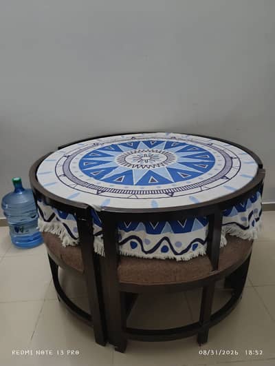 Stylish Round Center Table with Cushioned Stools | Modern Living Room