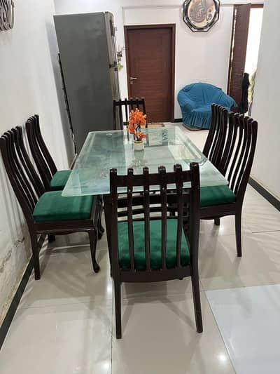 Dining table with six wooden chairs