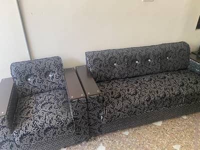 5 seater sofa along tables
