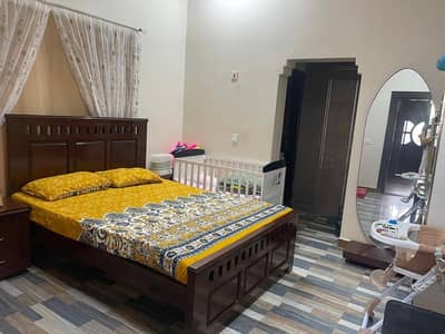 Queen sized Bed with 2 Bedside tables and dressing unit