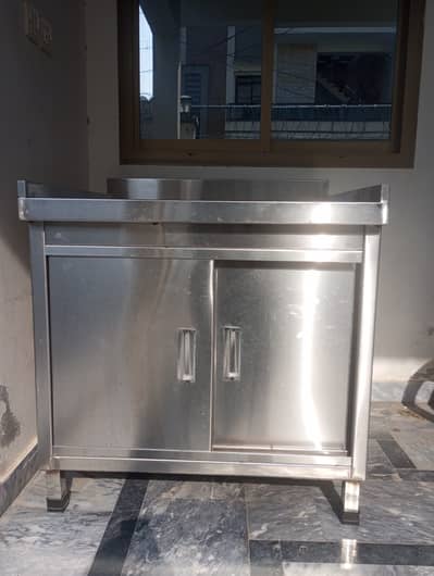 Stainless steel counter with cabinets